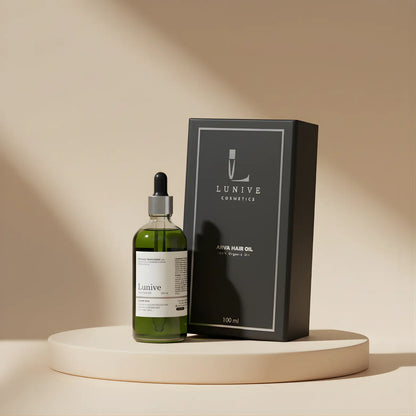 Lunive hair oil bottle and packaging on a beige surface with a neutral background